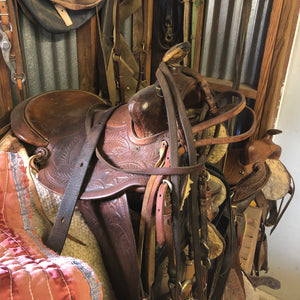West Texas Saddle Leather Products -  a saddle in a tack room.