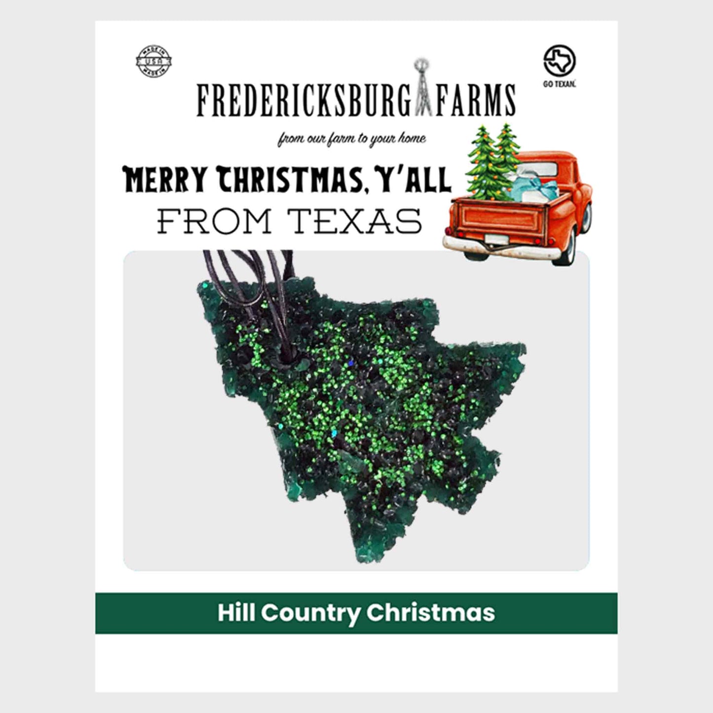 Air freshener shaped like a green Christmas tree.