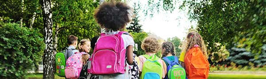 kids with backpacks going to school