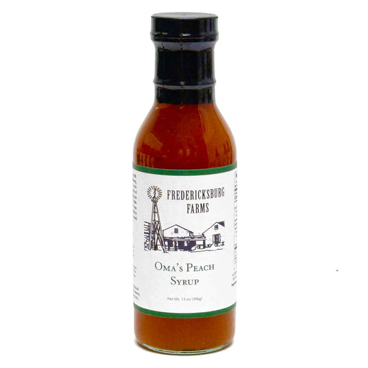 Bottle of Fredericksburg Farms Oma's Peach Syrup on a white background