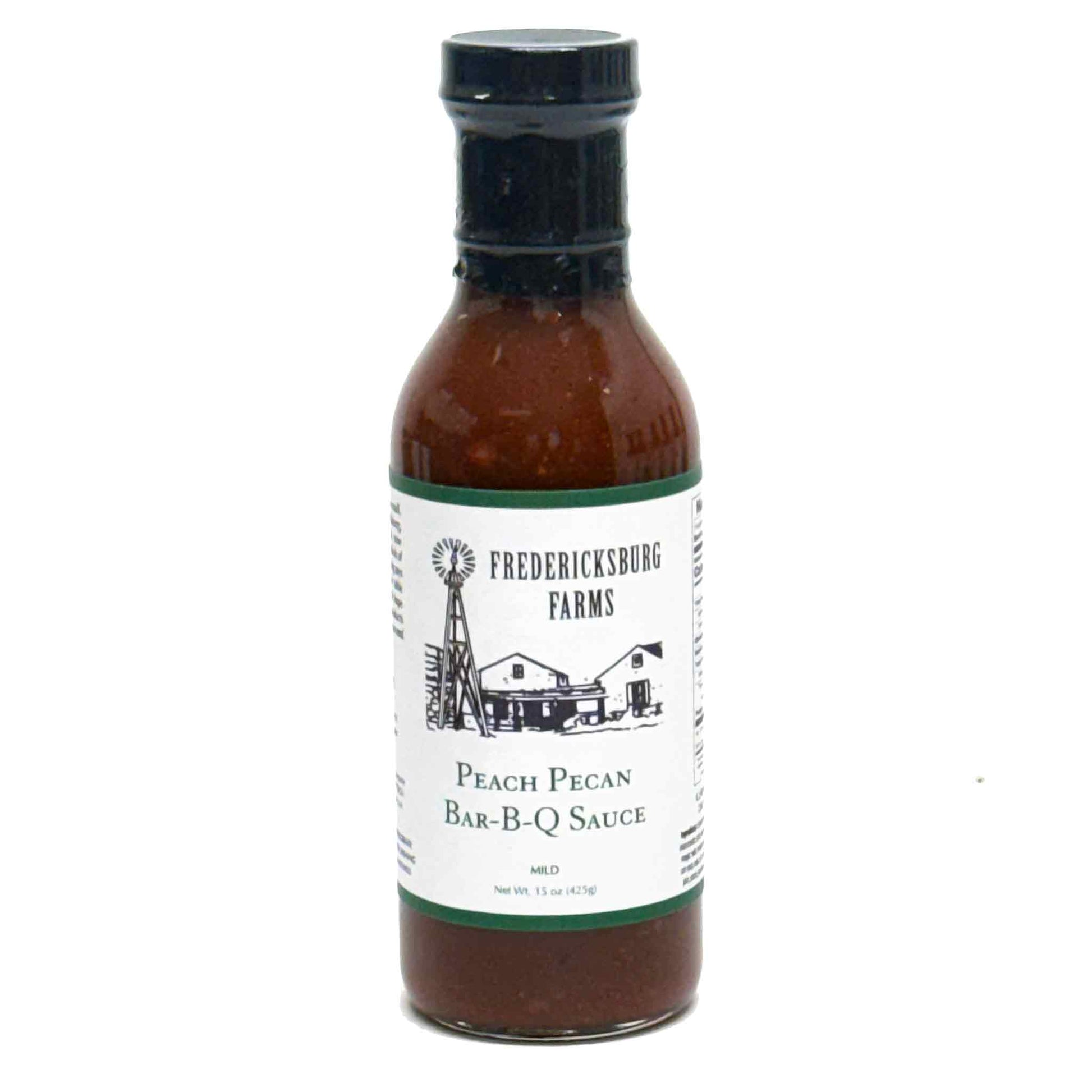 bottle of peach pecan BBQ sauce on white background