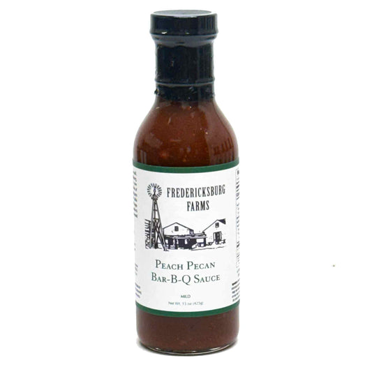 bottle of peach pecan BBQ sauce on white background