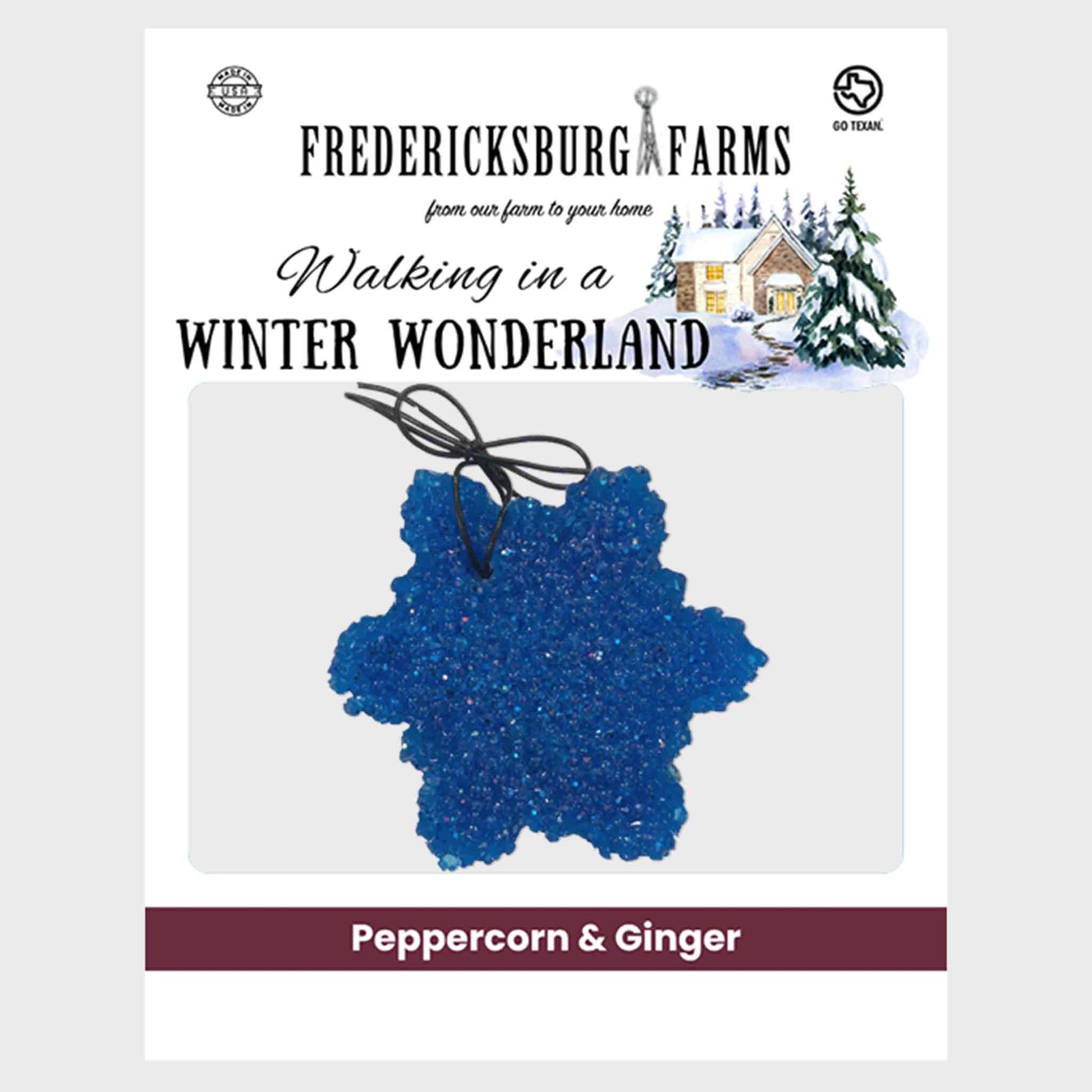 Fredericksburg Farms 'Walking in a Winter Wonderland' peppermint ornament package, featuring a blue glittery star-shaped ornament with a black hanging string on a white card with product branding and flavor text 'Peppercorn & Ginger'.